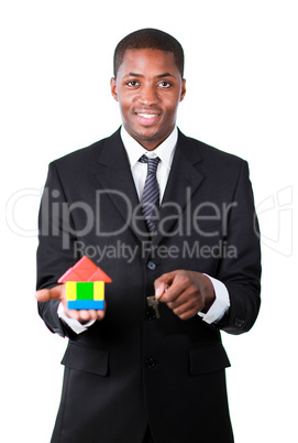Afro-American businessman showing a construction of a new house