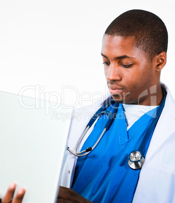 Young African doctor working on a laptop