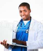 Handsome doctor working on a laptop