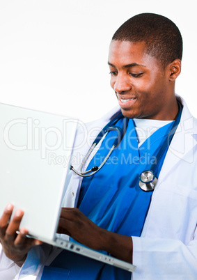 Friendly Afro-American doctor working on a laptop