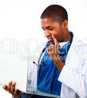 Close-up of an Thoughtful doctor working with a computer