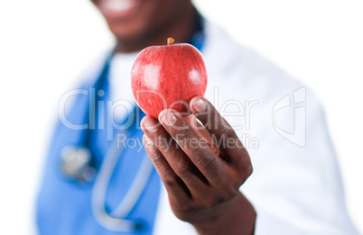 Close-up of an Smiling doctor holding an apple