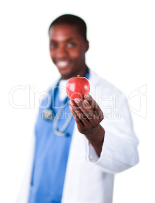 Smiling doctor holding an apple