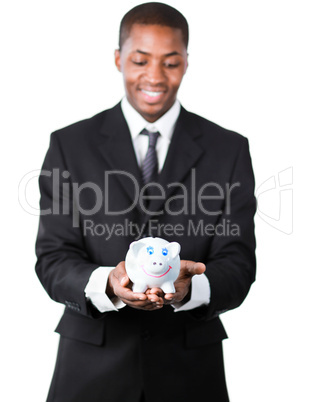 Portrait of an handsome businessman holding a piggy bank