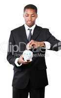 Portrait of a Businessman putting money in his piggy bank