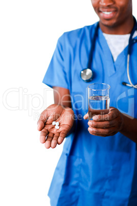 Young doctor showing pills and glass of water