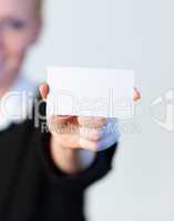 smiling Business woman holding out a business card