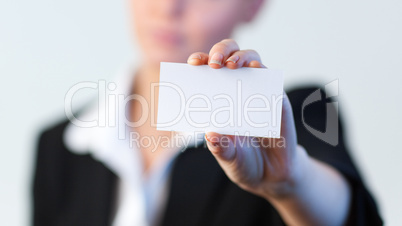 Business woman holding out a business card