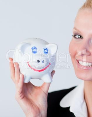 Business woman holding a piggy Bank