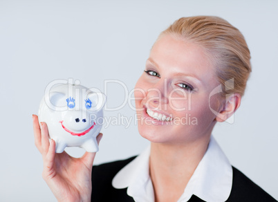 Business woman holding a piggy Bank
