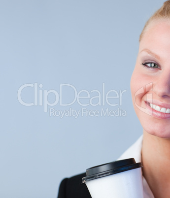Woman holding a take away coffee container