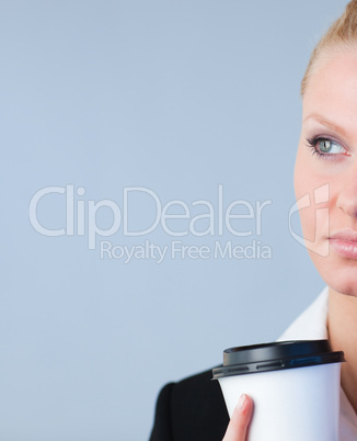 Woman holding a take away coffee container