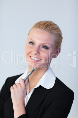 Businesswoman with pen in her hand