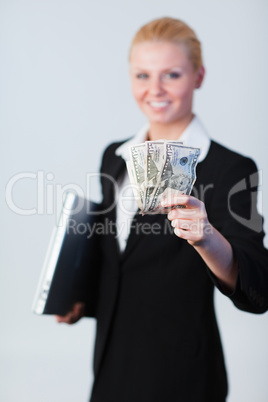 Woman with dollars and a laptop
