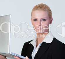 Happy Businesswoman holding a laptop
