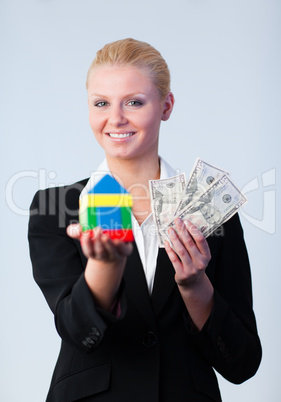 Woman holding a house