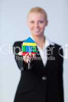 Woman holding house and dollars