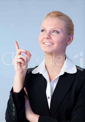 Happy Businesswoman pointing upwards