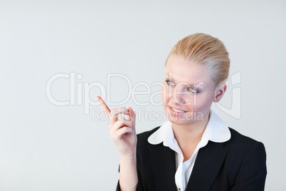 Businesswoman pointing to the side