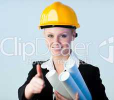 female constrcution worker with blueprints
