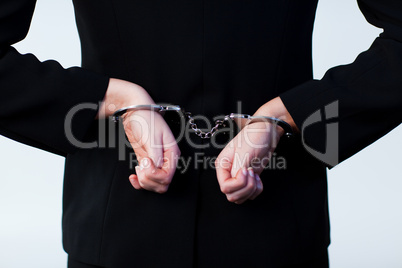 Business person handcuffed