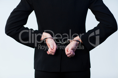 Business person handcuffed