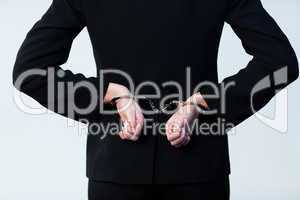 Business person handcuffed