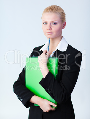 Woman standing holding a folder