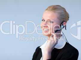 Attractive Business woman talking on a head piece