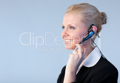 Attractive Business woman talking on a head piece
