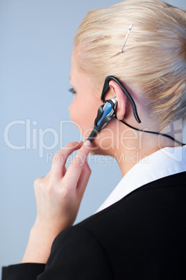 Business woman using a headset