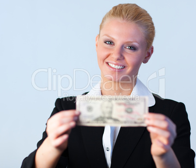 Business woman holding dollars to the camera