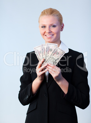 Business woman holding dollars to the camera