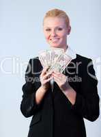 Business woman holding dollars to the camera