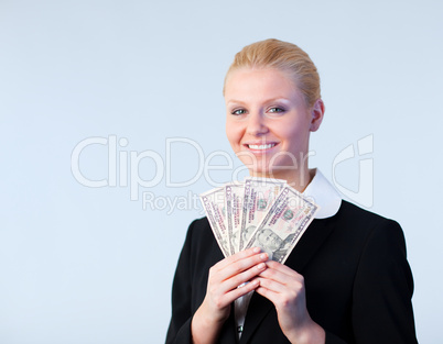 Business woman holding dollars up