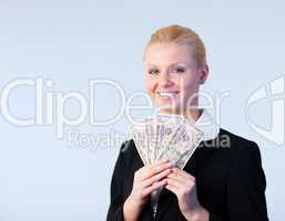 Business woman holding dollars up