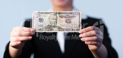 Business woman holding up dollars