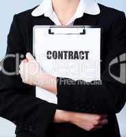 Woman holding a contract on a clipboard