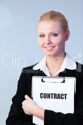 Woman holding a contract on a clipboard