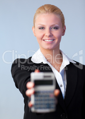 Business woman holding up a calculator