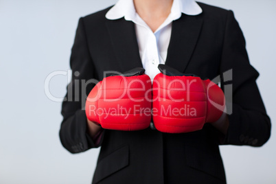 Business woman with boxing gloves on