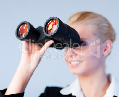 Busines woman looking through Binoculars