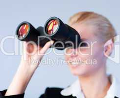 Busines woman looking through Binoculars