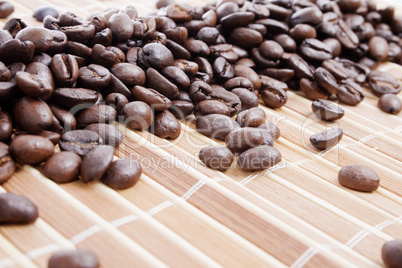 Coffee beans on bamboo placemat