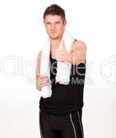 Sporting man with his thumbs up to the camera