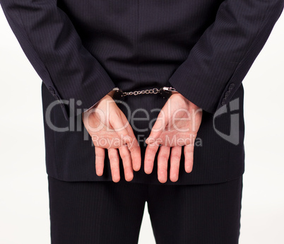 Businessman in hand cuffs
