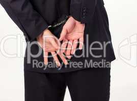 Young Businessman tied up in hand cuffs
