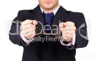 Businessman tied up in hand cuffs
