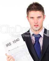 Man holding out his irs returns form