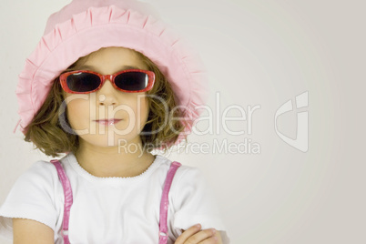 little girl with sun hat and sunglasses
